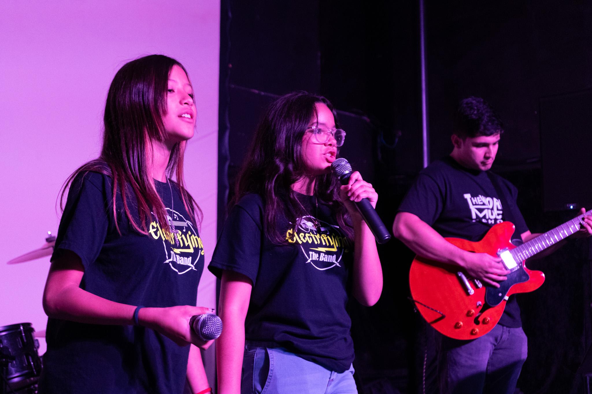 Band guitarists performing at Disney show