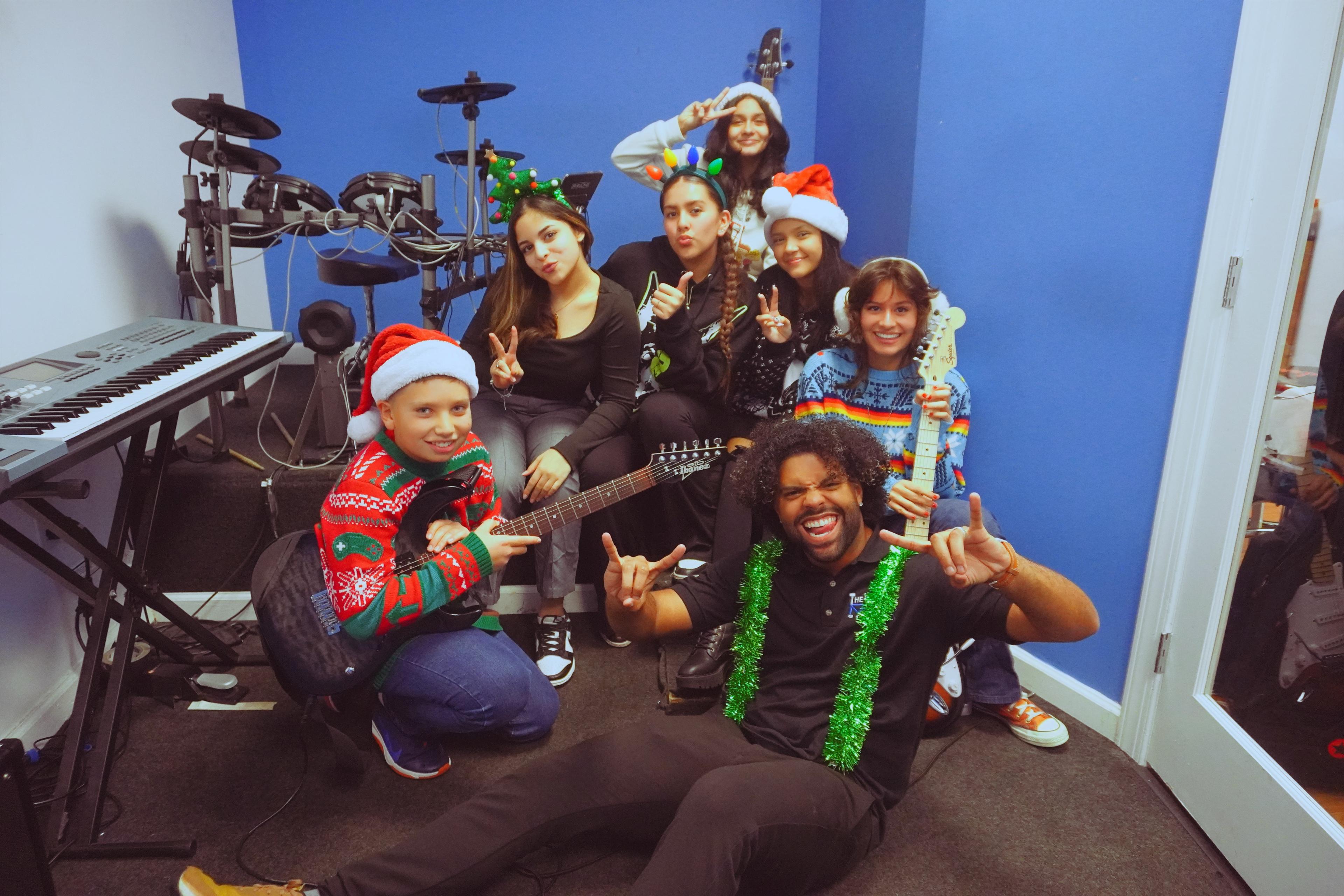 Band students in Christmas costumes with instruments