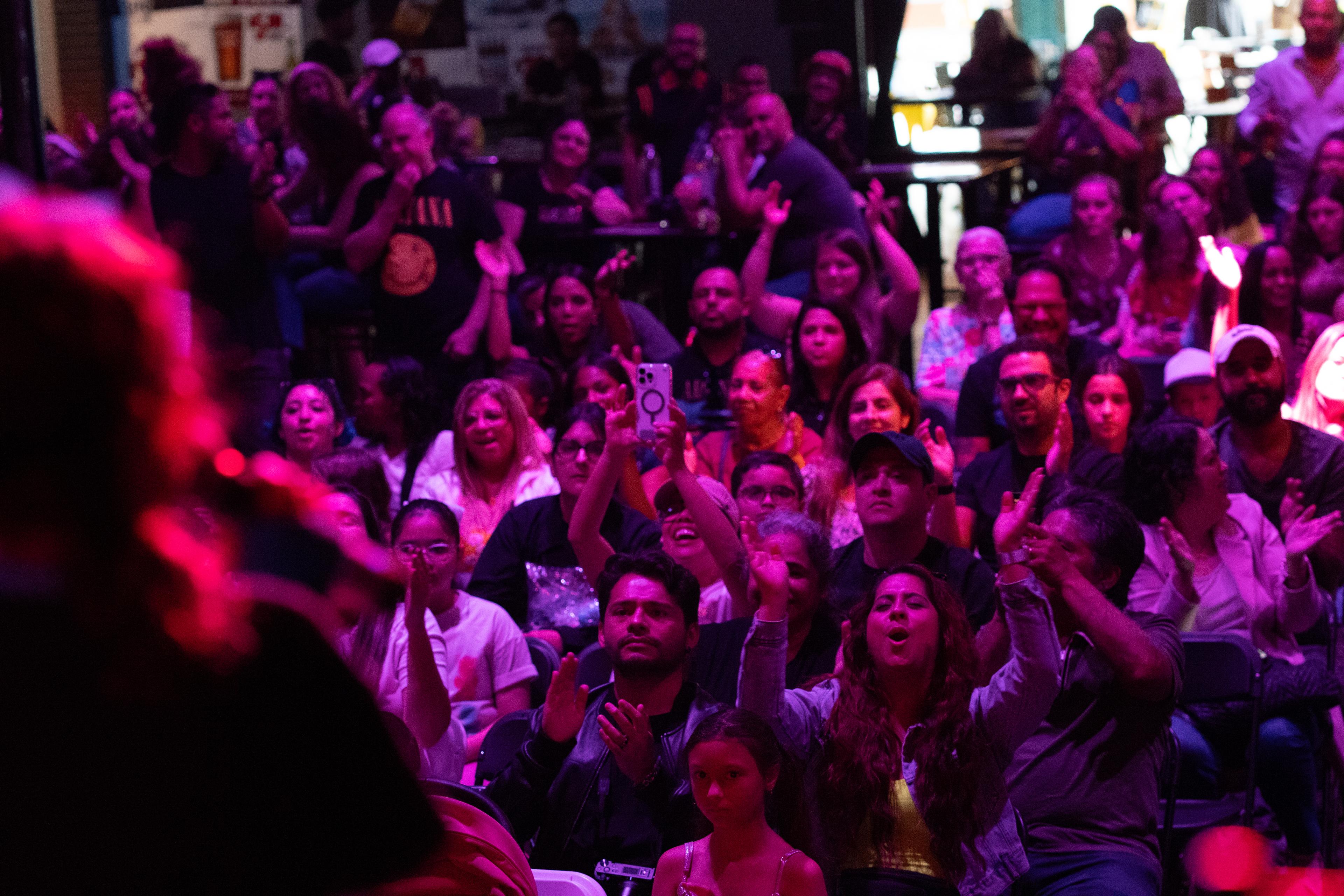 Families cheering at The World of Music concert