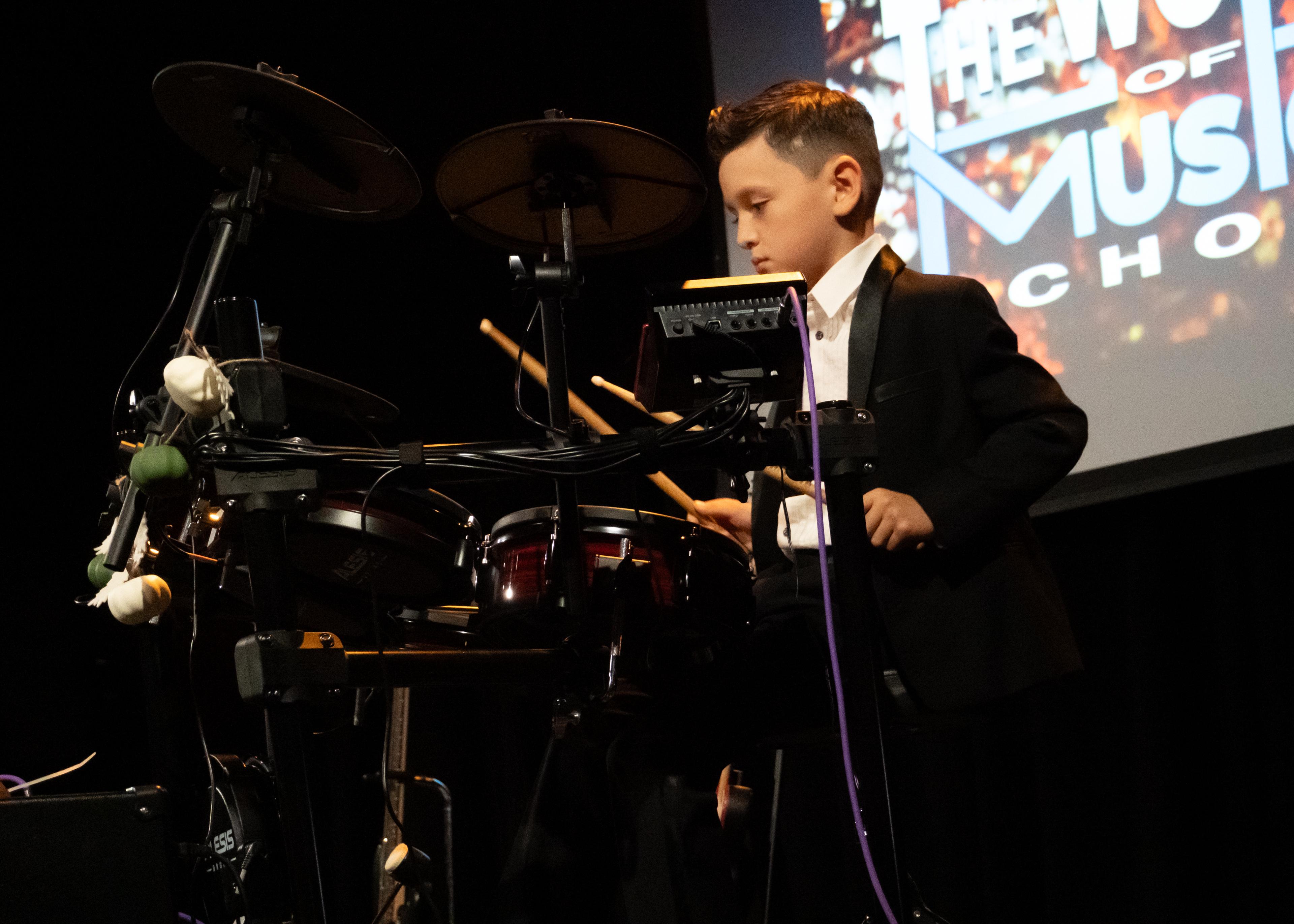 Drummer in suit on stage