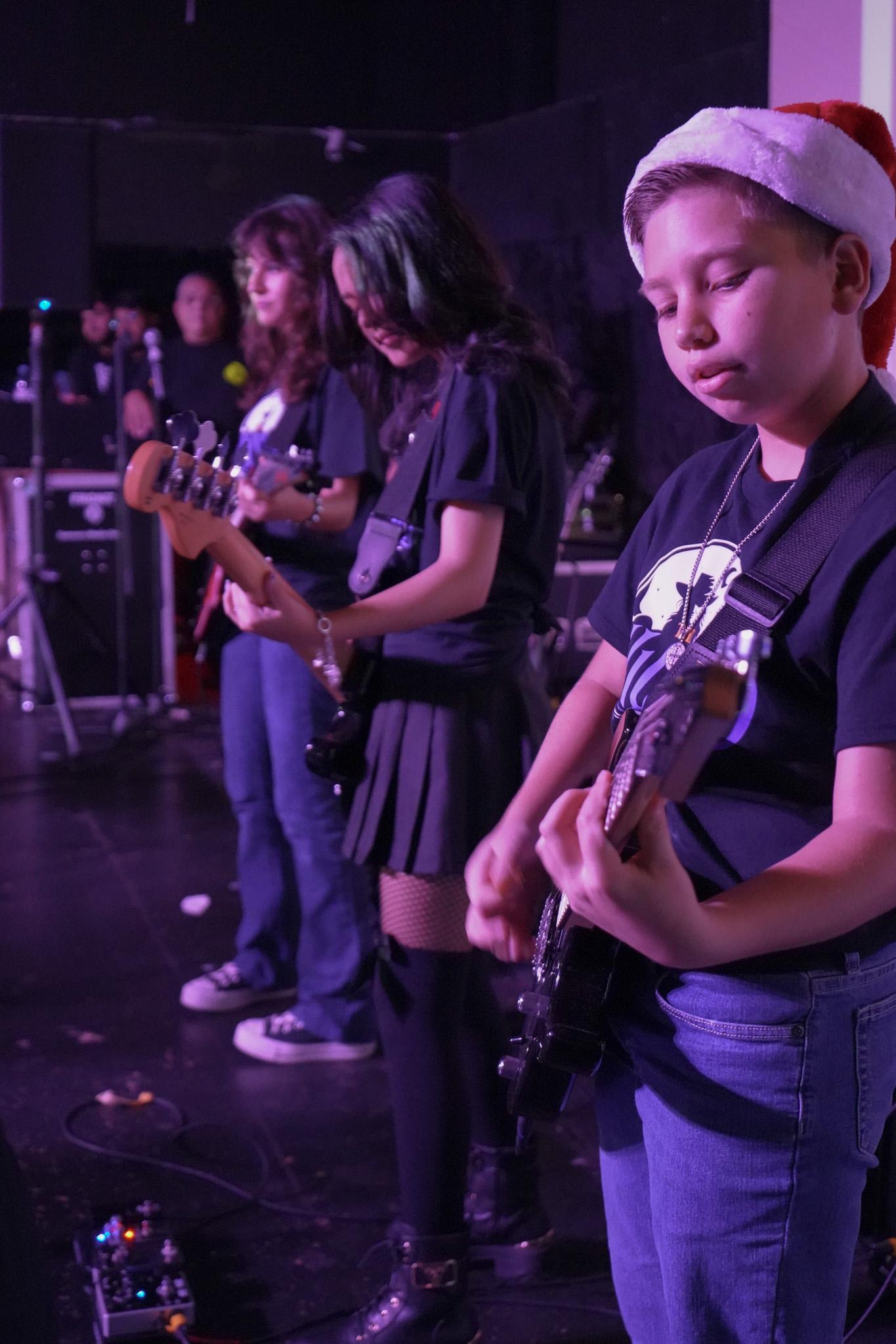 TWOM performers singing on stage