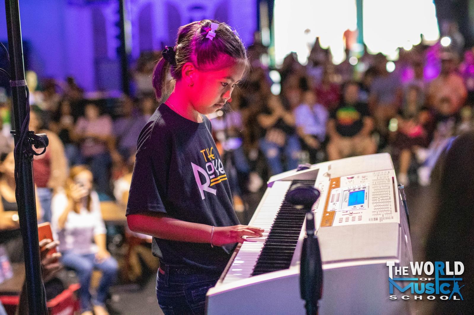 Students performing at The World of Music School