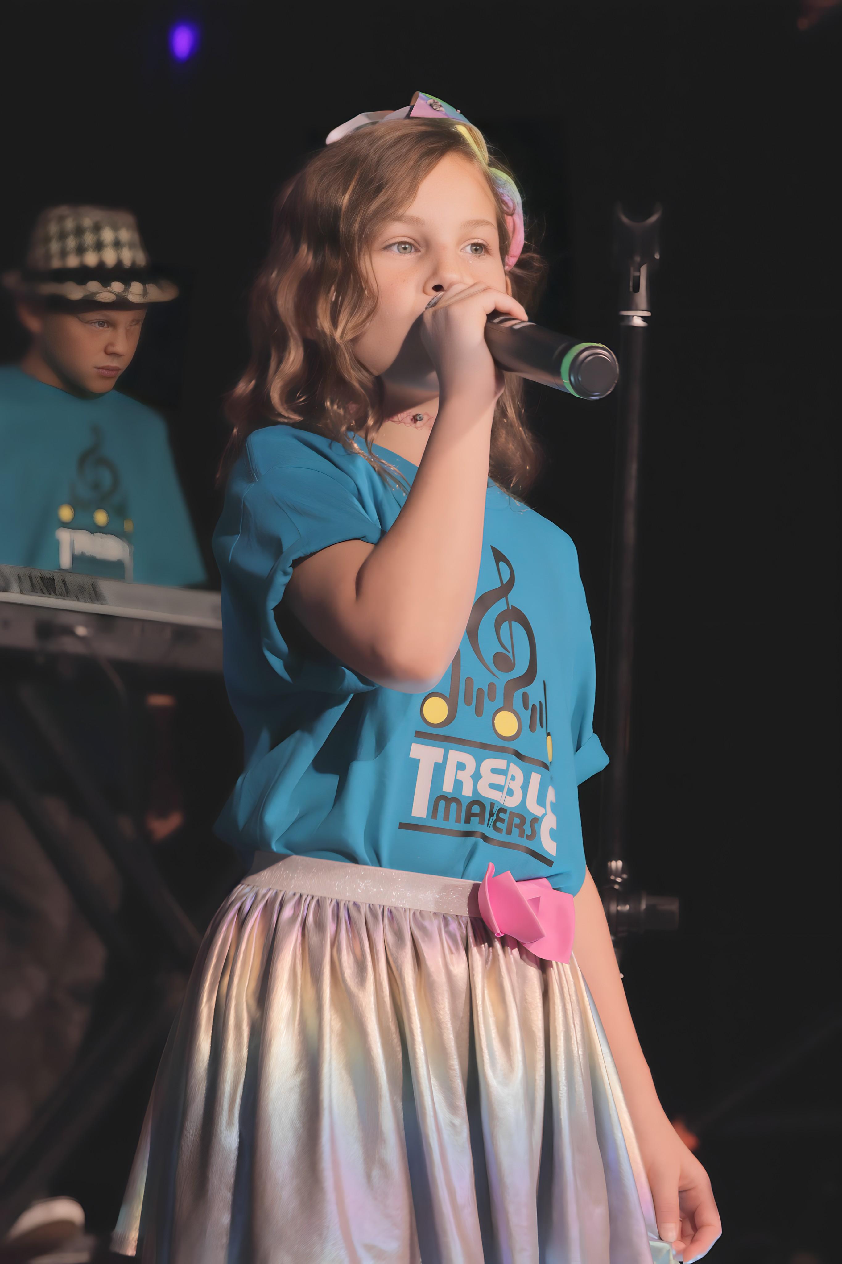 Young vocalist performing at concert